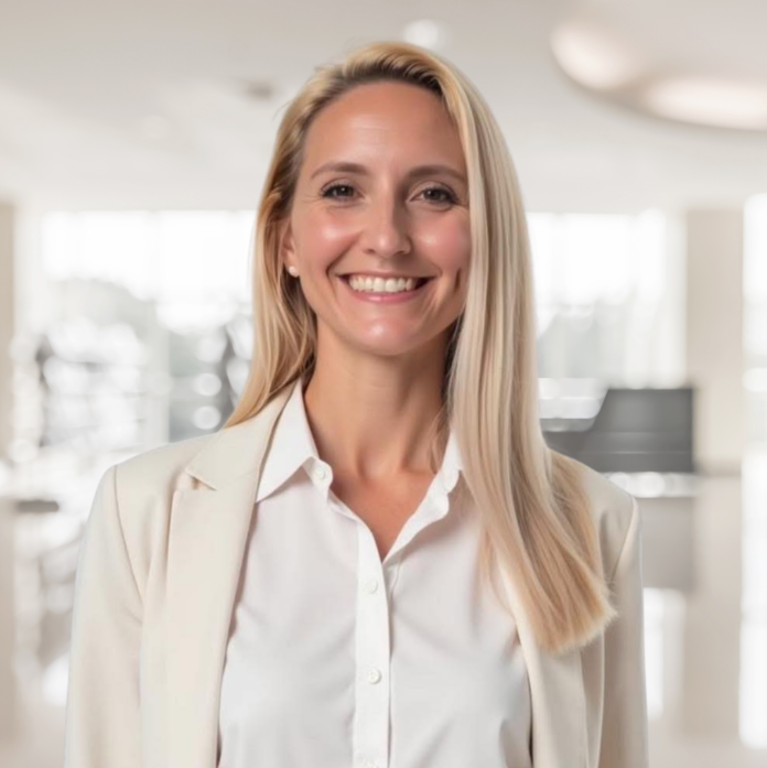 Dr. Megan Nickerson smiling in a bright clinical setting